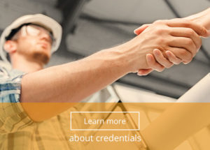 A construction holds blueprints and shake the hand of someone else. An option button at the bottom of the image reads "Learn more about our credentials."